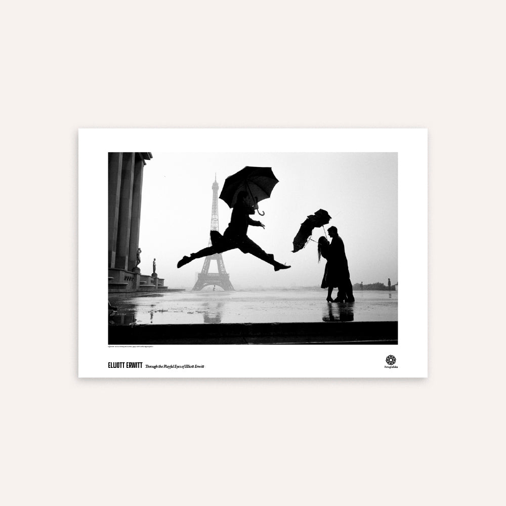 Black and white poster of man jumping and a couple with umbrellas in front of the Eiffel Tower.