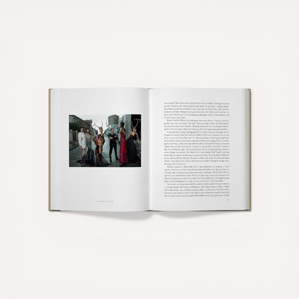 Open book with a photograph on the left page and text on the right page.