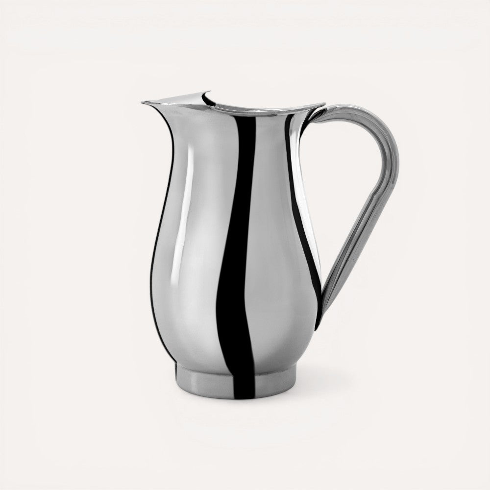 Silver pitcher with handle. 