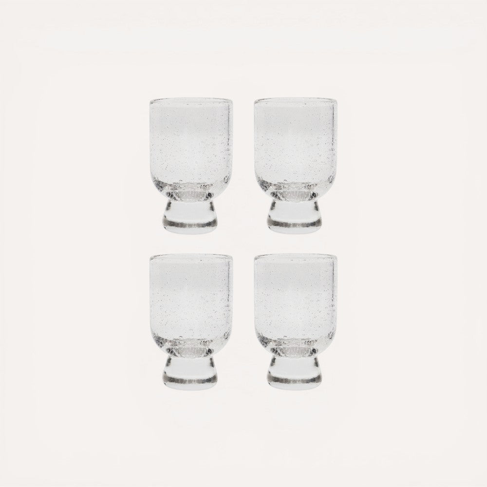 Set of four clear glasses.