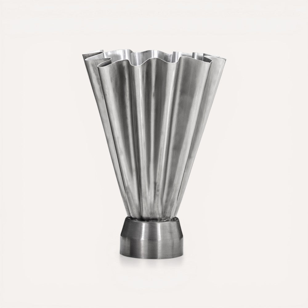 Metallic vase with fluted design. 