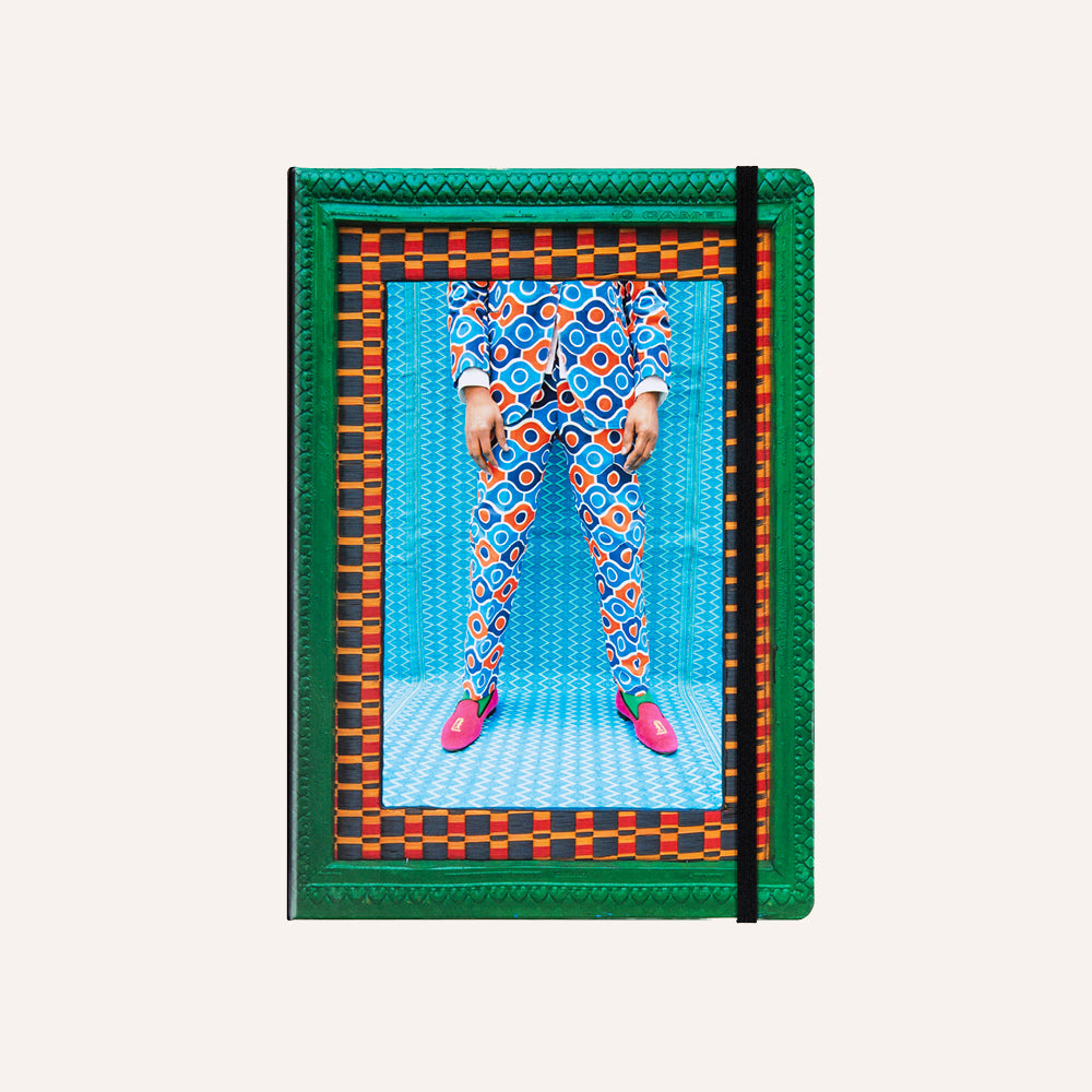 Notebook with a colorful design of a person in pajamas and slippers on the cover