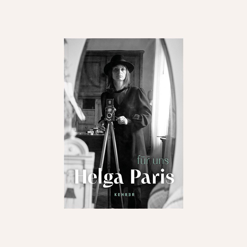 Book cover with a black and white photo of a person with a camera, featuring the 'Helga Paris'.
