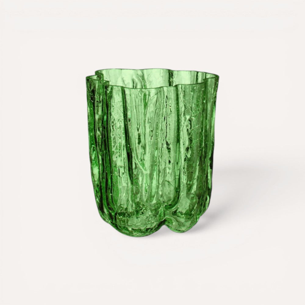 Green glass vase with textured surface.