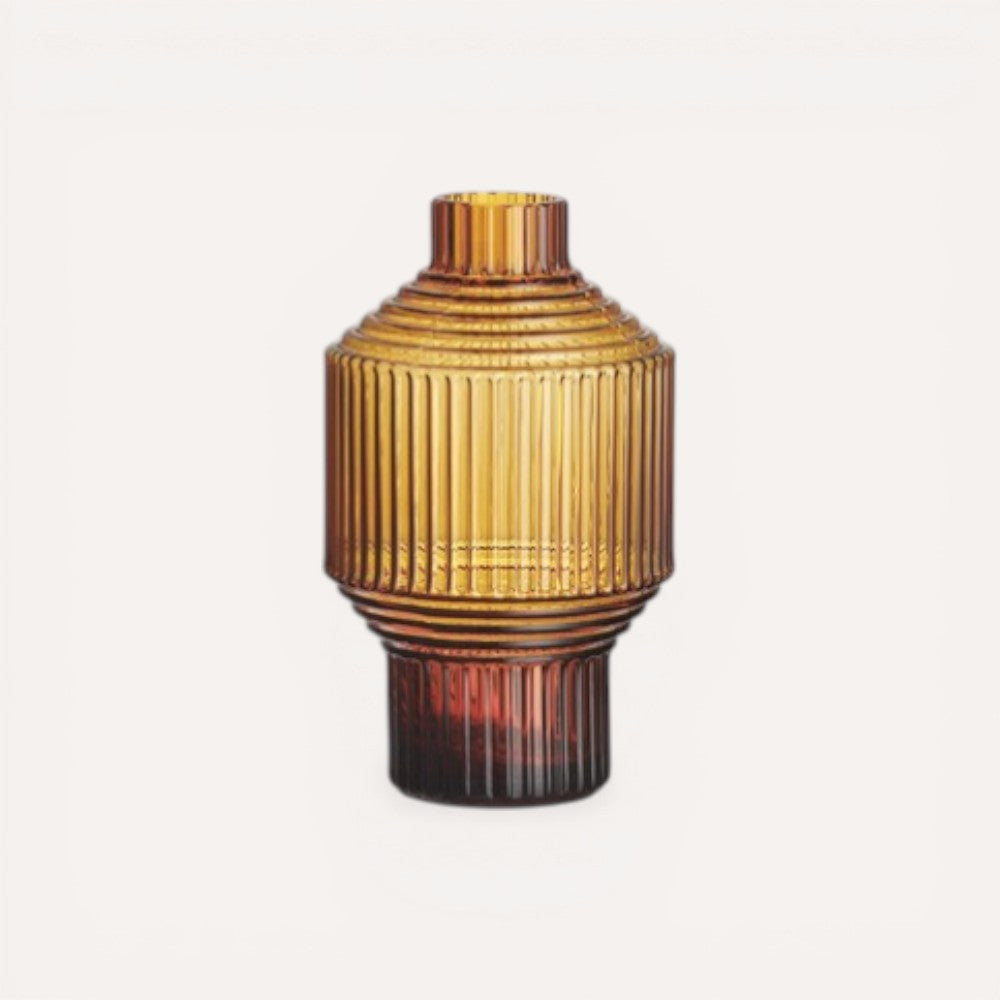 Decorative vase with ribbed texture on a light gray background