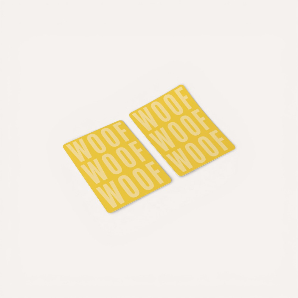 Two yellow coasters with 'WOOF' text.