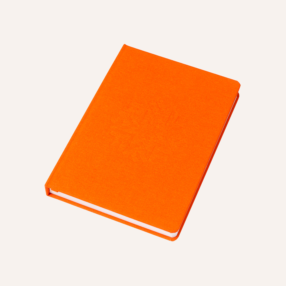 Orange notebook on a white background
