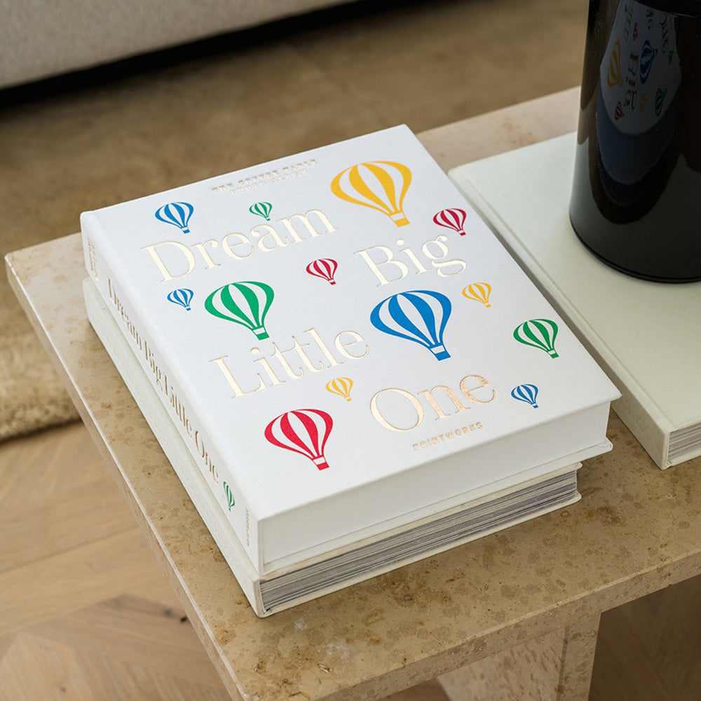 Photo album titled 'Dream Big Little One' with colorful hot air balloons.