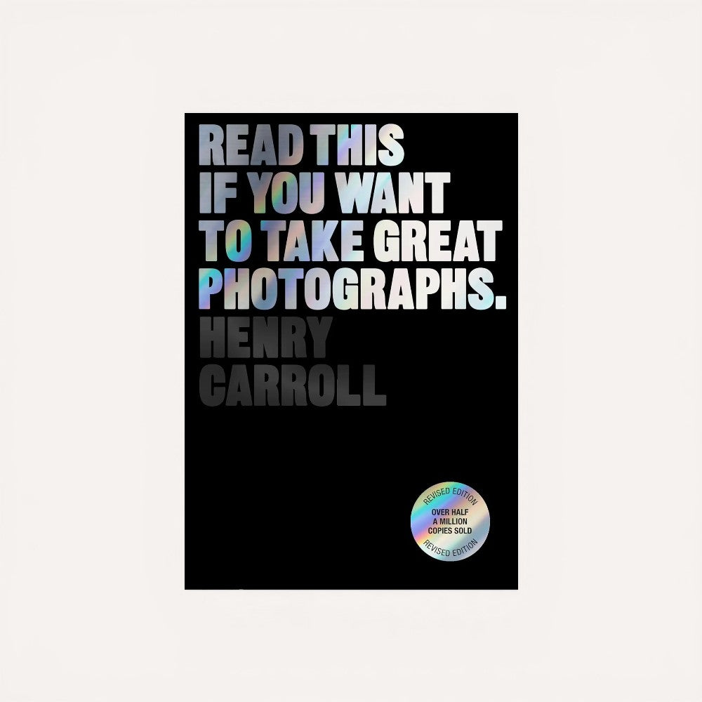 Book cover with text 'Read this if you want to take great photographs. Henry Carroll' on a black background.