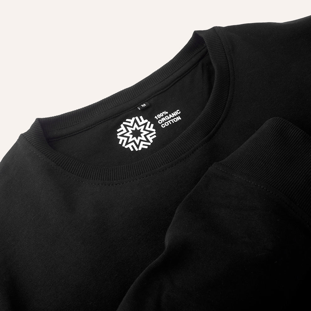 Black shirt with a visible label on the collar indicating 100% organic cotton.