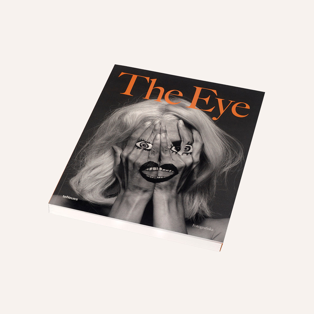 Book titled 'The Eye' with a cover featuring a black and white illustration of a woman with hands over her face.