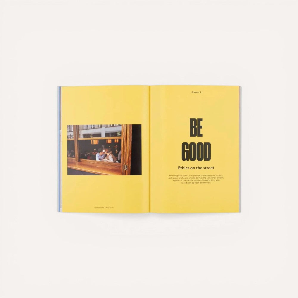 Open book with yellow pages displaying a photo and text on a yellow background