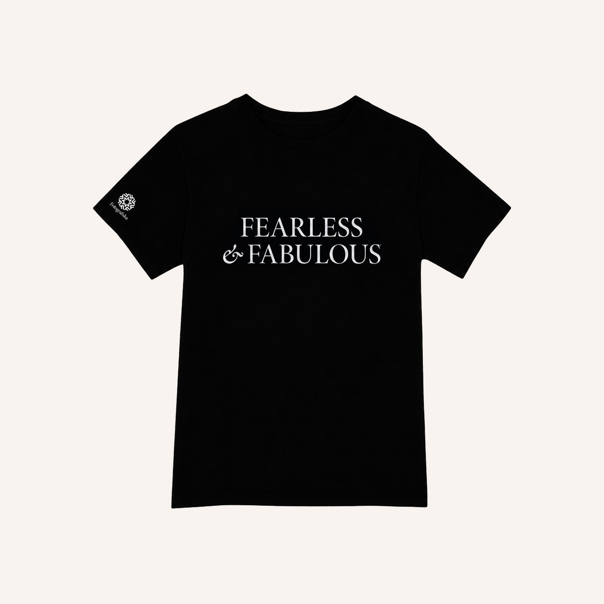 A black short-sleeve crewneck t-shirt with 'FEARLESS & FABULOUS' printed in white serif text across the chest, displayed flat against a light cream background.