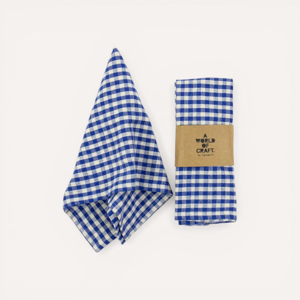 Blue and white checkered napkns with a brown label on a light gray background