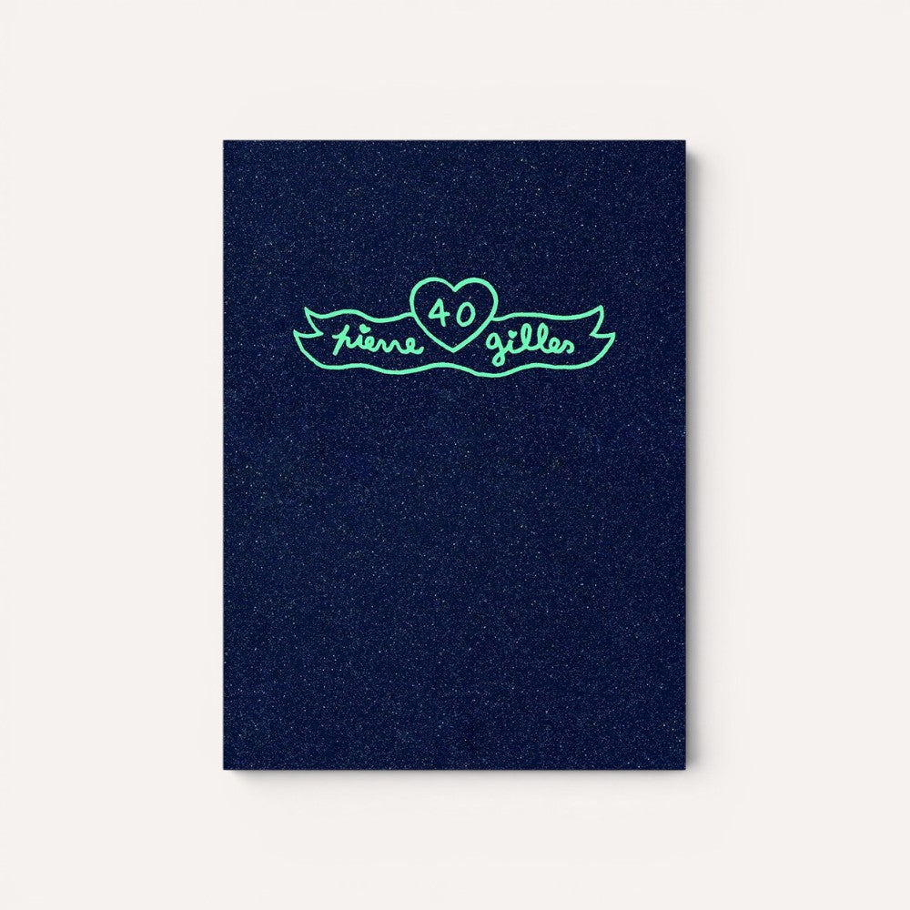 Navy blue book cover with green text and heart design by Pierre et Gilles. 