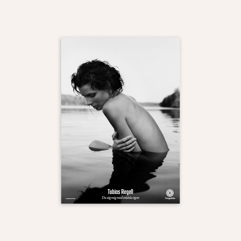 Black and white poster of a person in water with 'Tobias Regell' text.