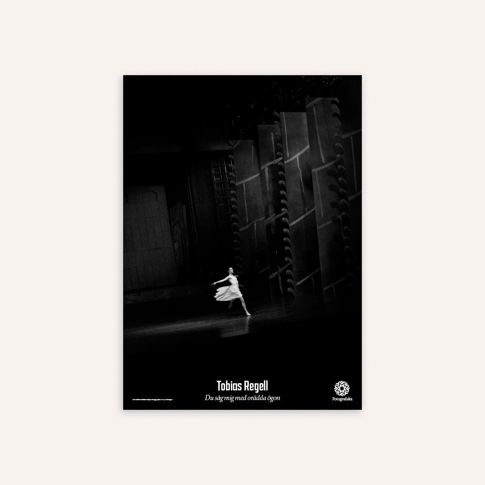 Black and white poster of a dancer in a dark setting with 'Tobias Regell' branding.