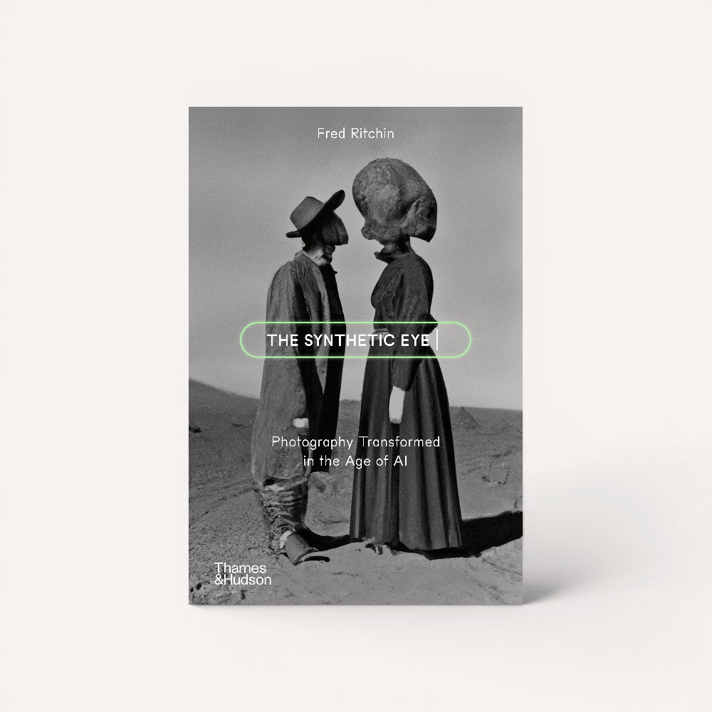 Book cover of 'The Synthetic Eye' by Fred Ritchin with a black and white photo of two figures on a desert landscape.