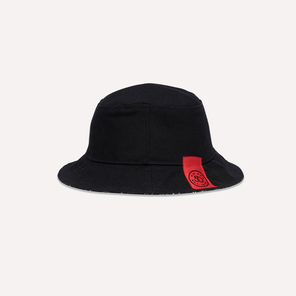 Black bucket hat with a red label 